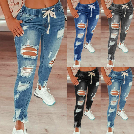 Die Jeans der heißen verkaufenden Frauen nehmen die Jeans-Hose der abnehmenden Frauen ab